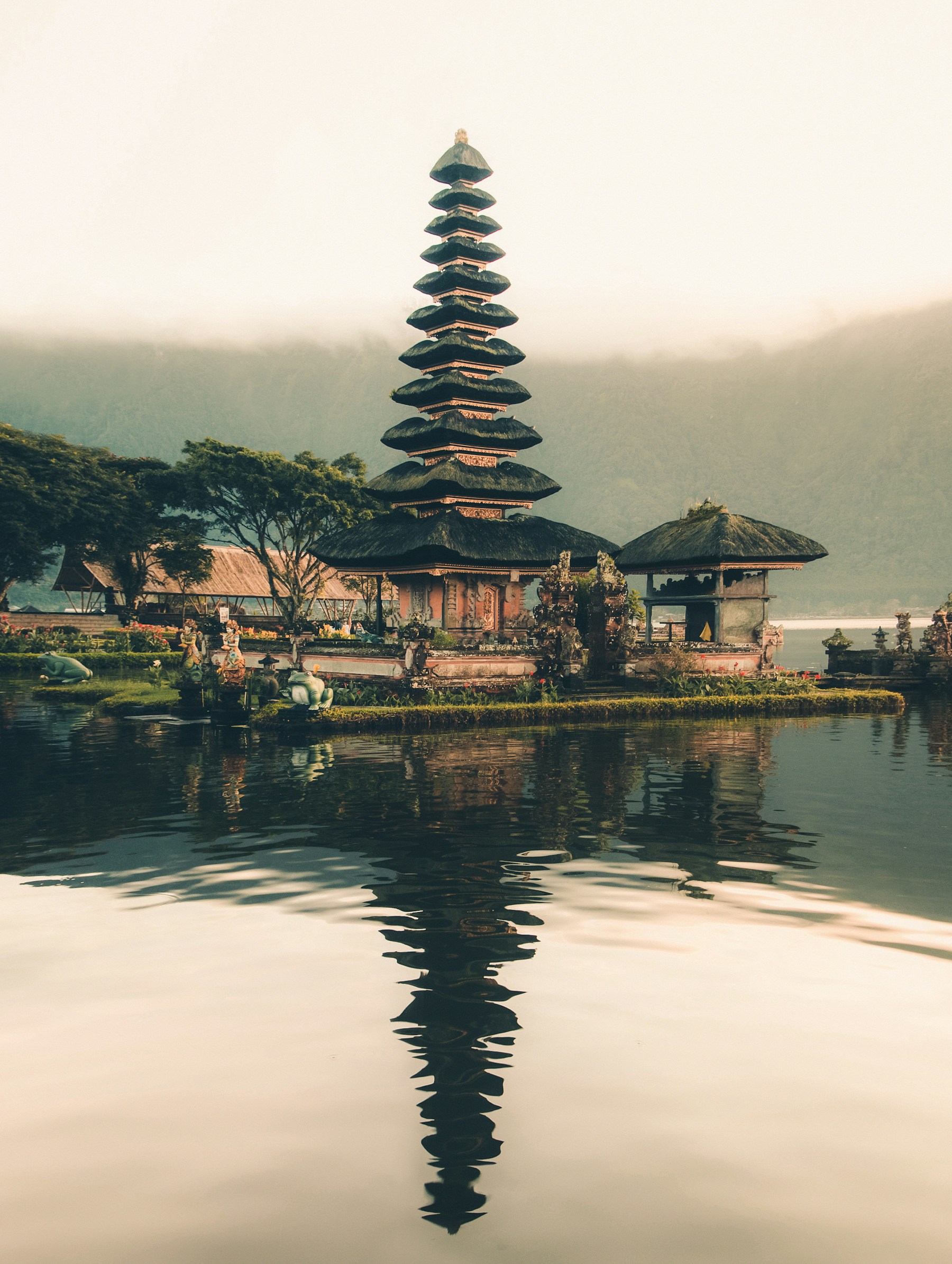 Balinese temple beside a tranquil lake